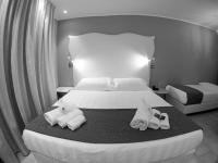 Posteľ alebo postele v izbe v ubytovaní El Patio Hotel
