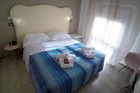 Posteľ alebo postele v izbe v ubytovaní El Patio Hotel
