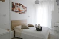 A bed or beds in a room at SoleLuna Fiera 6 Rooms
