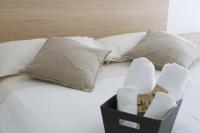 A bed or beds in a room at SoleLuna Fiera 6 Rooms