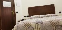 A bed or beds in a room at Agriturismo San Martino