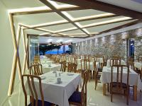 Reštaurácia alebo iné gastronomické zariadenie v ubytovaní Eleftheria Hotel
