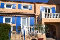 a blue house with white windows and blue shutters at Résidence Niccola in Vidauban
