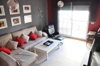Televízia a/alebo spoločenská miestnosť v ubytovaní Apartamento San Luis