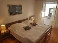 Postel nebo postele na pokoji v ubytování Apartman Nadia