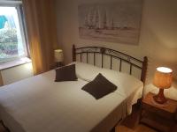 Postel nebo postele na pokoji v ubytování Apartman Nadia