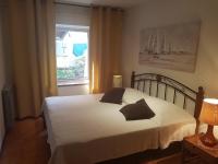 Postel nebo postele na pokoji v ubytování Apartman Nadia