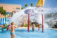 a group of children playing in a water park at Hipotels Barrosa Garden in Chiclana de la Frontera