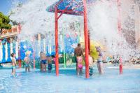 a group of people playing in a water park at Hipotels Barrosa Garden in Chiclana de la Frontera