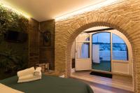 Postel nebo postele na pokoji v ubytování Hotel Posada de las Cuevas
