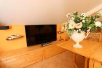 Televízia a/alebo spoločenská miestnosť v ubytovaní Incanto Sorrentino - De Vivo Realty Sorrento