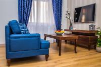 Televízia a/alebo spoločenská miestnosť v ubytovaní Apartamenty Glamour