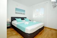 Posteľ alebo postele v izbe v ubytovaní Apartments Town
