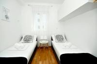 Posteľ alebo postele v izbe v ubytovaní Apartments Town
