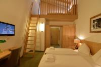 Łóżko lub łóżka w pokoju w obiekcie Hotel St. Florian - Kaprun
