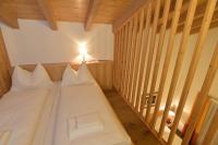 Łóżko lub łóżka w pokoju w obiekcie Hotel St. Florian - Kaprun