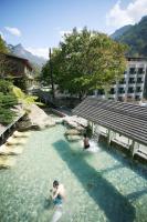 a couple of people in a pool of water at King&#39;s Resort &amp; Spa in Tai&#39;an