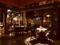 a dining room with tables and chairs in a restaurant at The Deer Head Inn in Kenting