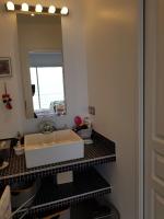 a bathroom with a sink and a mirror at Vue mer.Tranquilité.Cap d&#39;Ail à 10 mn de MONACO in Cap d&#39;Ail