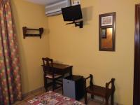 Televízia a/alebo spoločenská miestnosť v ubytovaní Hotel Riavela
