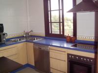 a kitchen with a sink and a dishwasher at El Palacete in Setenil