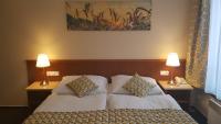 Posteľ alebo postele v izbe v ubytovaní Aparthotel Austria Suites