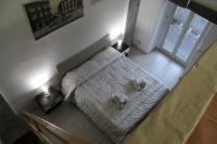 Posteľ alebo postele v izbe v ubytovaní Home Greco