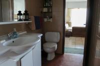 a bathroom with a white sink and a toilet at Holiday Home by the Sea in Nea Potidaea
