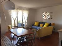 a living room with a couch and a table at Residence port la galere in Théoule-sur-Mer
