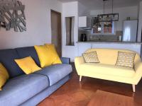 a living room with a couch and two chairs at Residence port la galere in Théoule-sur-Mer