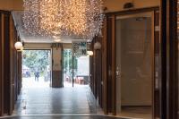 a hallway of a store with a chandelier at Brà Guest House in Verona