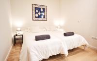 A bed or beds in a room at Setefilla Deluxe Suite by Valcambre