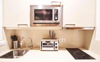 A kitchen or kitchenette at Setefilla Deluxe Suite by Valcambre