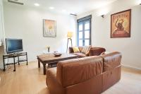 A television and/or entertainment centre at Setefilla Deluxe Suite by Valcambre