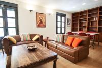 A seating area at Setefilla Deluxe Suite by Valcambre
