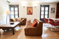 A seating area at Setefilla Deluxe Suite by Valcambre