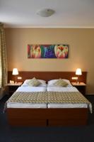 Posteľ alebo postele v izbe v ubytovaní Aparthotel Austria Suites
