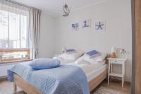 Posteľ alebo postele v izbe v ubytovaní Apartamenty Sun & Snow Rezydencja Park