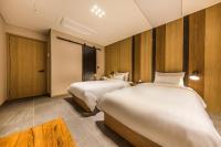 Incheon Airport Hotel Seattleにあるベッド