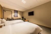 Incheon Airport Hotel Seattleにあるテレビまたはエンターテインメントセンター