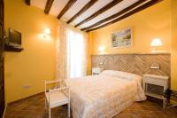 Postel nebo postele na pokoji v ubytování Hotel Rural El Pilaret
