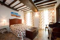 Postel nebo postele na pokoji v ubytování Hotel Rural El Pilaret