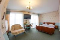 Posteľ alebo postele v izbe v ubytovaní GarageHotel