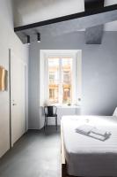 A bed or beds in a room at Pietra - The Italian Stay Collection