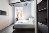 A bed or beds in a room at Pietra - The Italian Stay Collection