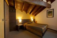 Łóżko lub łóżka w pokoju w obiekcie Locanda Sant'Ambrogio