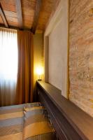 Łóżko lub łóżka w pokoju w obiekcie Locanda Sant'Ambrogio