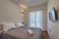 Posteľ alebo postele v izbe v ubytovaní Adriatic Apartments Fažana