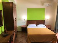 A bed or beds in a room at Il Melograno