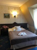 Postel nebo postele na pokoji v ubytování Oławian Hotel